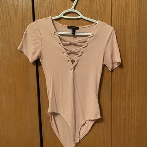 Pale pink body suit